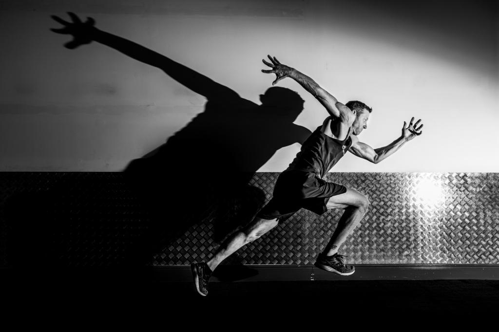 An image that is printed on the walls Sanctuary Cove Country Club gym featuring the gym's own trainers.
