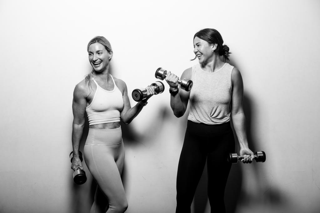 An image that is printed on the walls Sanctuary Cove Country Club gym featuring the gym's own trainers.